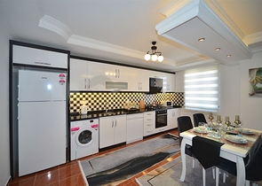 Трехкомнатная квартира в районе Махмутлар