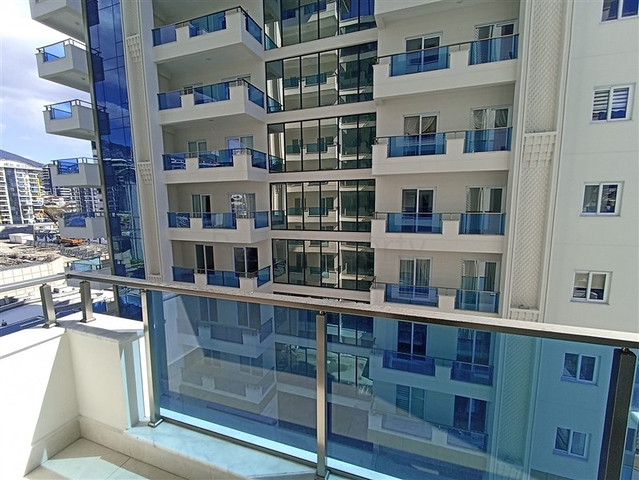 Трехкомнатная квартира в районе Махмутлар