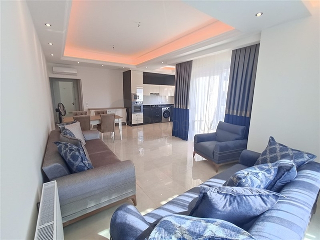 Трехкомнатная квартира в районе Махмутлар