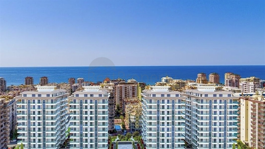 Трехкомнатная квартира в районе Махмутлар