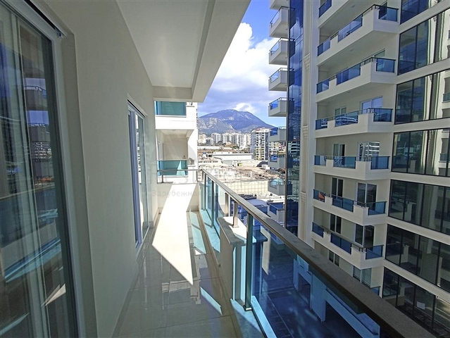 Трехкомнатная квартира в районе Махмутлар