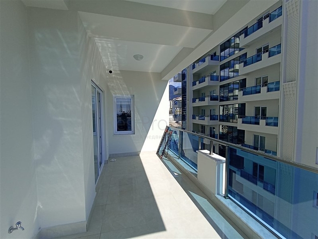 Трехкомнатная квартира в районе Махмутлар