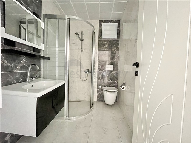 Просторная новая двухкомнатная квартира в Махмутларе