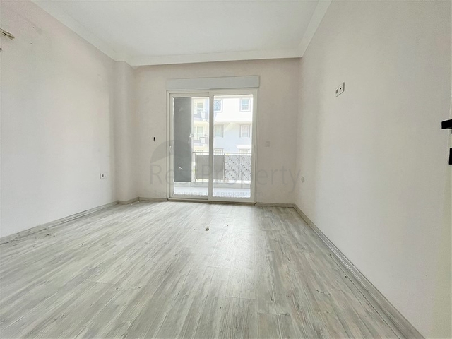 Просторная новая двухкомнатная квартира в Махмутларе