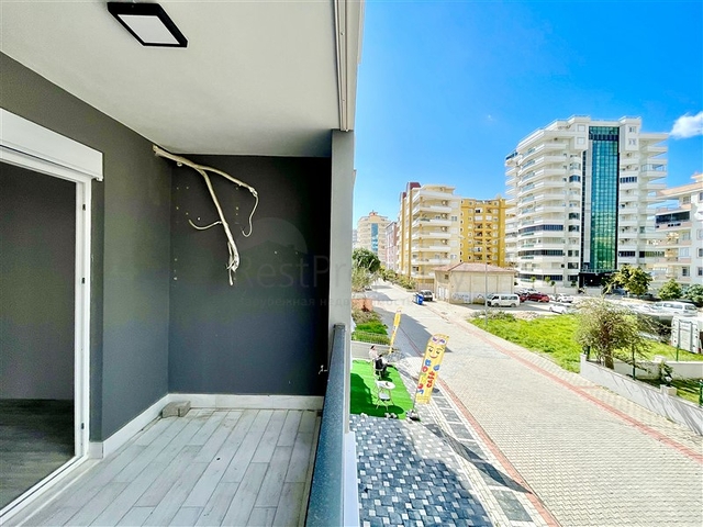 Просторная новая двухкомнатная квартира в Махмутларе