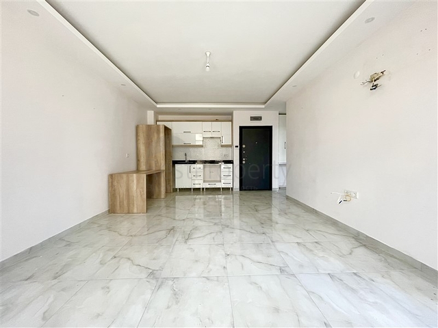 Просторная новая двухкомнатная квартира в Махмутларе