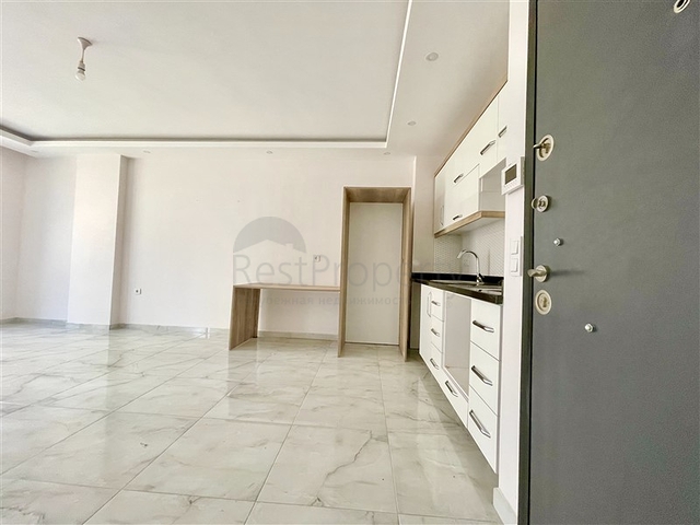 Просторная новая двухкомнатная квартира в Махмутларе