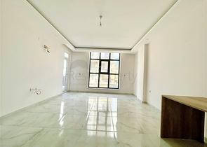 Просторная новая двухкомнатная квартира в Махмутларе