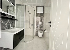 Просторная новая двухкомнатная квартира в Махмутларе