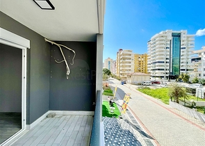 Просторная новая двухкомнатная квартира в Махмутларе