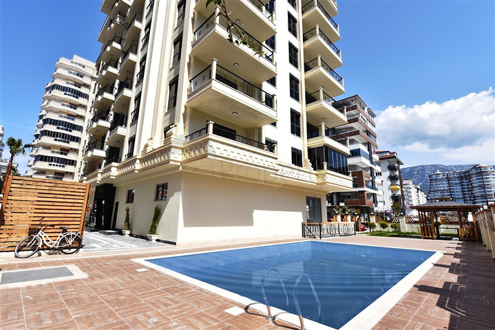 Трехкомнатные апартаменты в жилом комплексе в районе Махмутлар