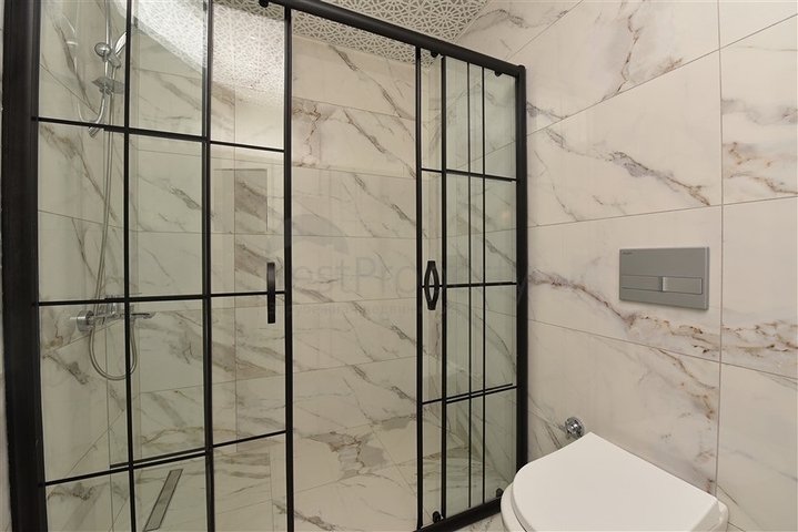 Трехкомнатные апартаменты в жилом комплексе в районе Махмутлар