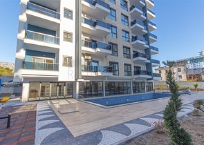 Меблированная двухкомнатная квартира в Махмутларе