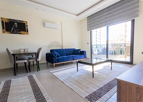 Меблированная двухкомнатная квартира в Махмутларе