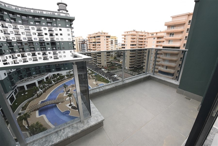 Квартира 1+1 в новом комплексе с отельной инфраструктурой в районе Махмутлар