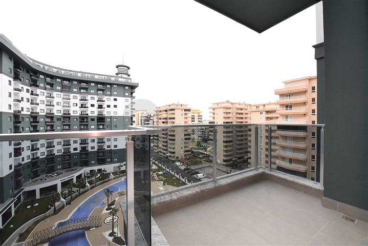 Квартира 1+1 в новом комплексе с отельной инфраструктурой в районе Махмутлар