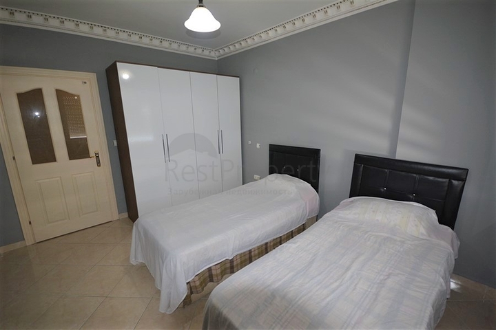 Трехкомнатная квартира в районе Махмутлар