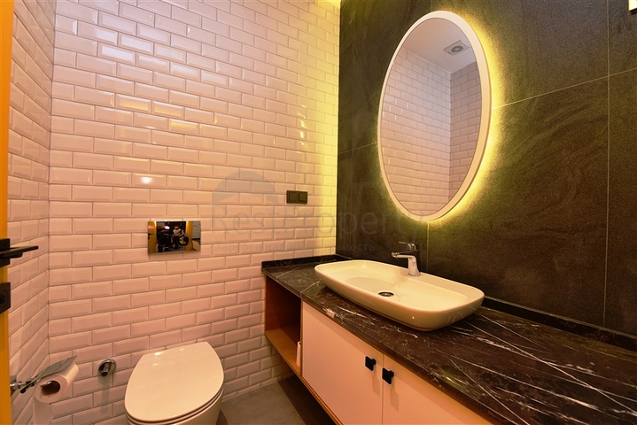 Садовый дуплекс планировки 2+1 в районе пляжа Клеопатра