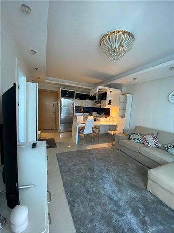 Двухкомнатная квартира в шикарном комплексе района Махмутлар