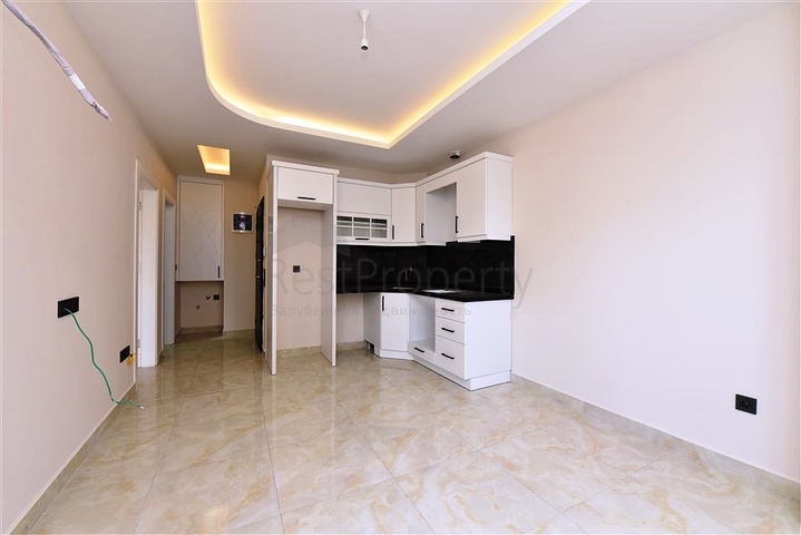 Квартира 1+1 в новом комплексе в районе Махмутлар