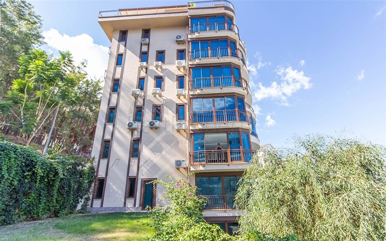 Садовый дуплекс 3+1 с видом на море в районе Каргыджак