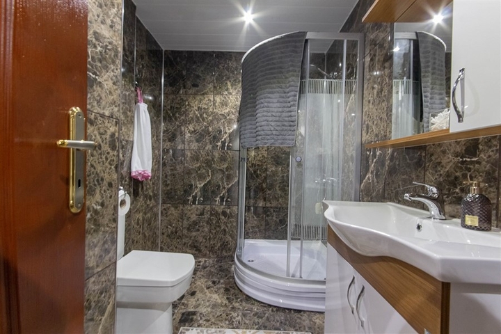 Садовый дуплекс 3+1 с видом на море в районе Каргыджак