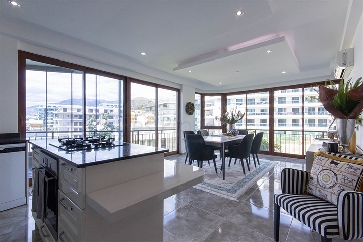 Садовый дуплекс 3+1 с видом на море в районе Каргыджак