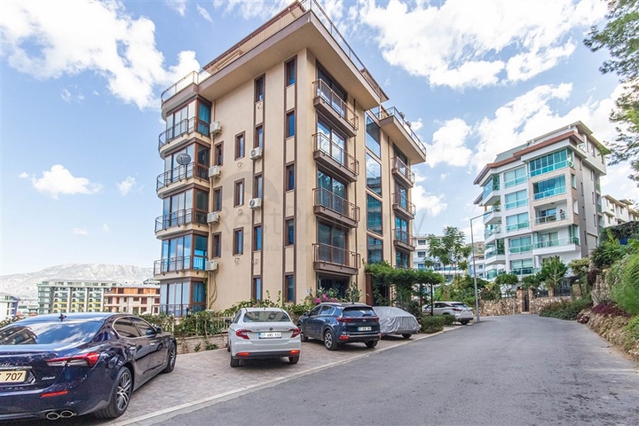 Садовый дуплекс 3+1 с видом на море в районе Каргыджак