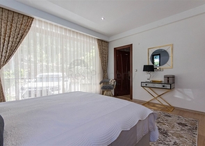 Садовый дуплекс 3+1 с видом на море в районе Каргыджак