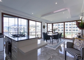 Садовый дуплекс 3+1 с видом на море в районе Каргыджак