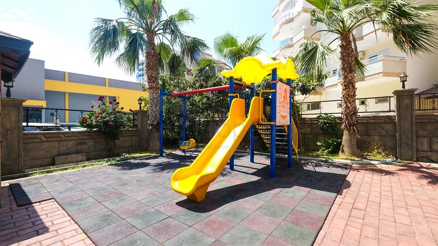 Трехкомнатная квартира в районе Махмутлар