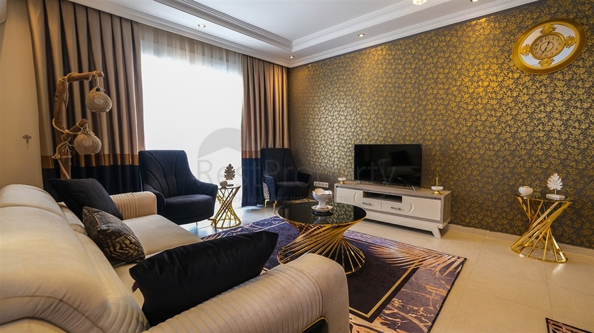 Трехкомнатная квартира в районе Махмутлар