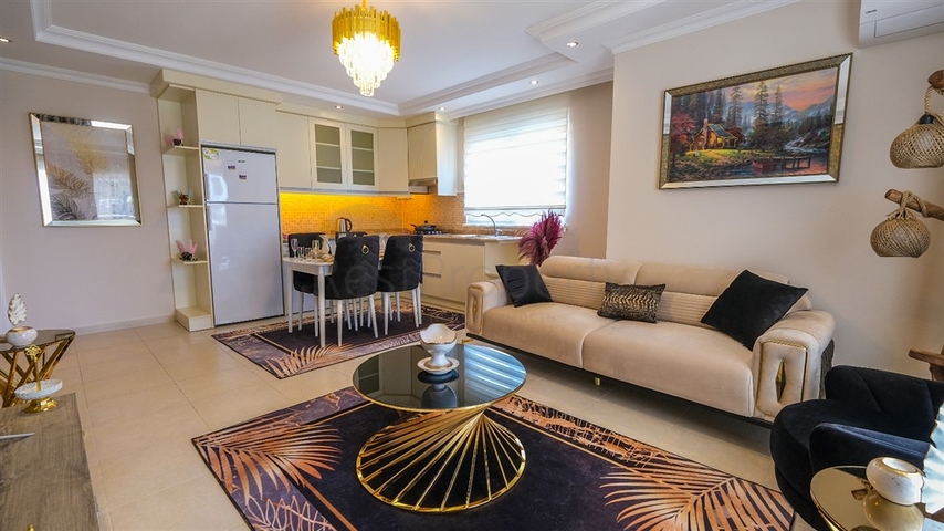 Трехкомнатная квартира в районе Махмутлар