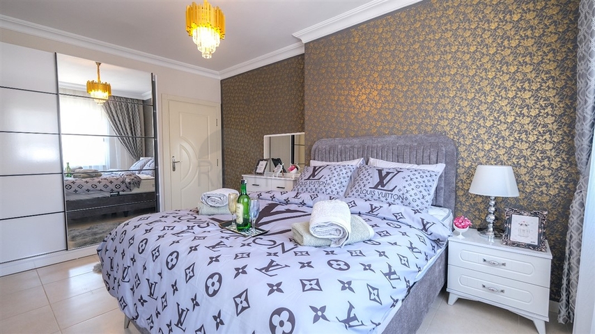 Трехкомнатная квартира в районе Махмутлар