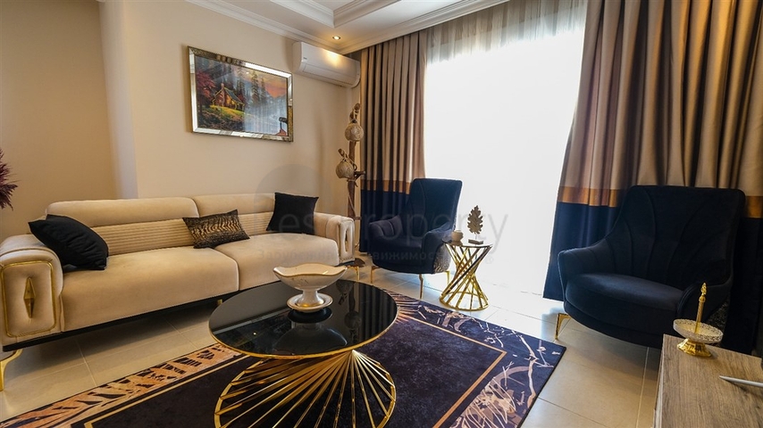 Трехкомнатная квартира в районе Махмутлар