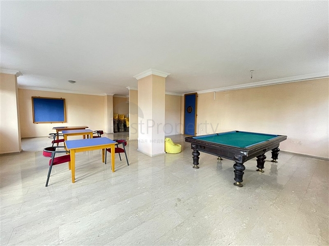 Трехкомнатная квартира на первой линии в районе Махмутлар