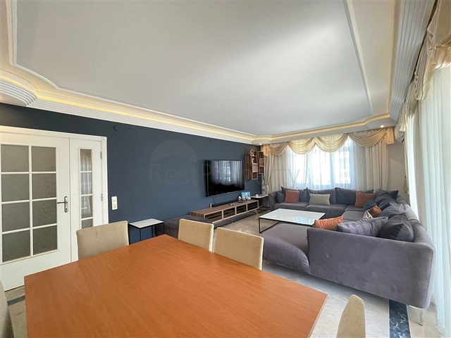 Трехкомнатная квартира на первой линии в районе Махмутлар