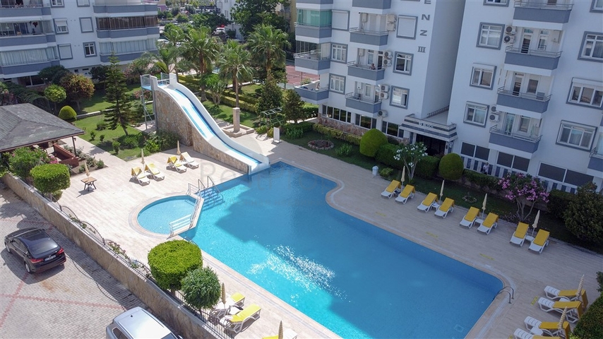 Трехкомнатная квартира на первой линии в районе Махмутлар