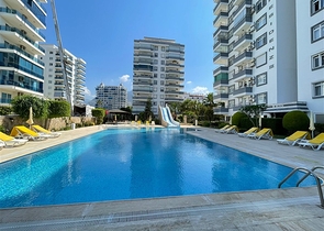 Трехкомнатная квартира на первой линии в районе Махмутлар