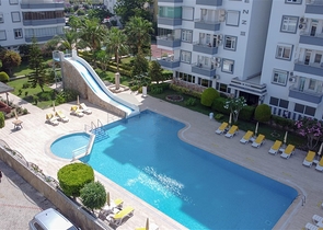 Трехкомнатная квартира на первой линии в районе Махмутлар