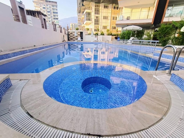 Квартира планировкой 2+1 в районе Махмутлар