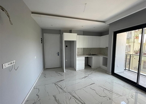 Новые апартаменты 1+1 в центре Алании