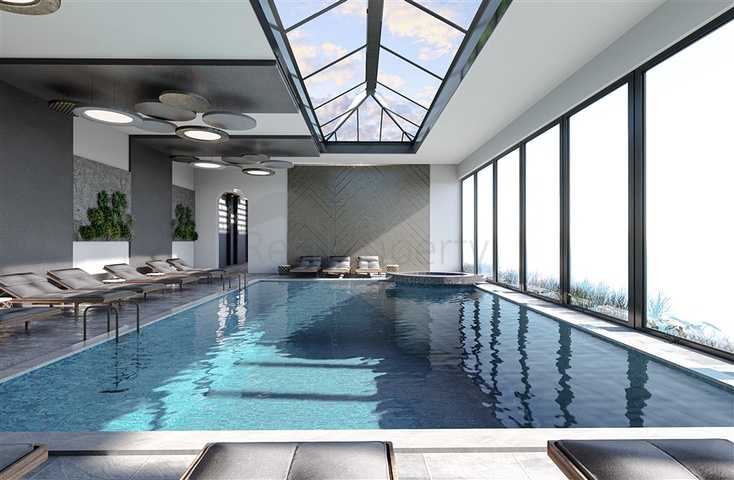 Двухкомнатная квартира с панорамным видом на горы в районе Махмутлар