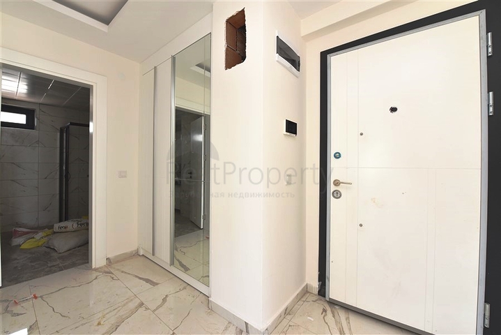 Двухкомнатная квартира с панорамным видом на горы в районе Махмутлар