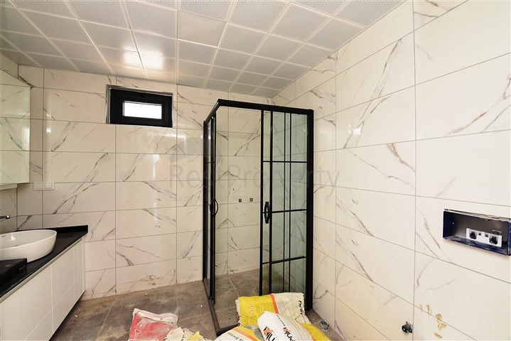 Двухкомнатная квартира с панорамным видом на горы в районе Махмутлар