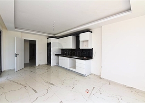 Двухкомнатная квартира с панорамным видом на горы в районе Махмутлар