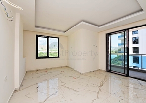 Двухкомнатная квартира с панорамным видом на горы в районе Махмутлар