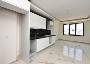 Двухкомнатная квартира с панорамным видом на горы в районе Махмутлар