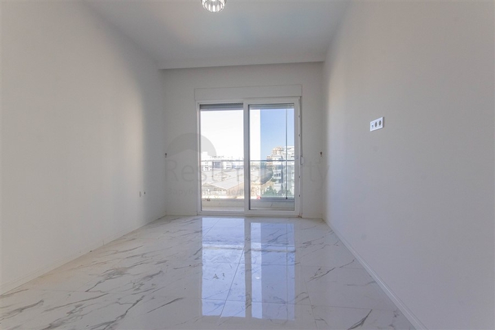 Большая квартира 1+1 в районе Махмутлар 