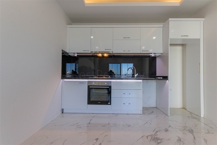 Большая квартира 1+1 в районе Махмутлар 